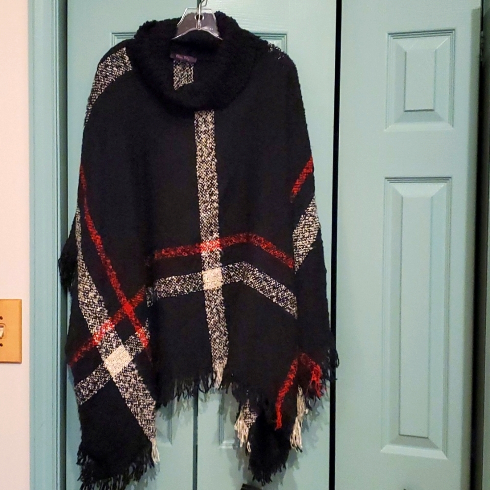 Black cape with red and white stripes